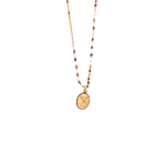 Medalla ovalada para Bautizo con imagen en relieve de bebé y Espíritu Santo.  Oro Amarillo de 10 kilates.