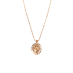 Medalla ovalada para Bautizo con imagen en relieve del Espíritu Santo adornada con zirconias en corte brillante y contorno troquelado.  Oro Amarillo de 10 kilates.