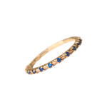 Churumbela con zirconia; en color oro amarillo con zirconias color azul vista completa de perfil